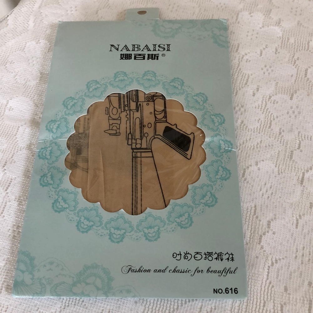 Beige/natural tights with machine gun design.